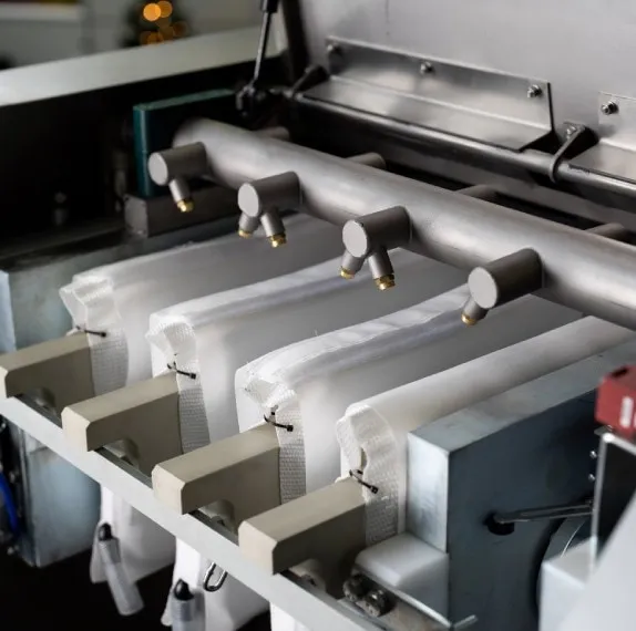 Mini Compact M 3.1 Premium — Hot-dip galvanized filter press with stainless steel cover and drainage channel.